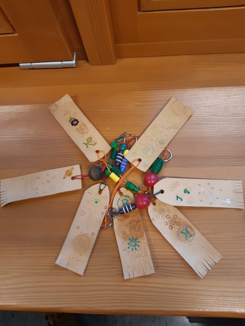 Making leather bookmarks and key rings for 12 participants - Image 3